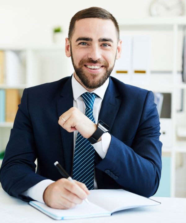 happy-ceo-at-desk-NV439M2